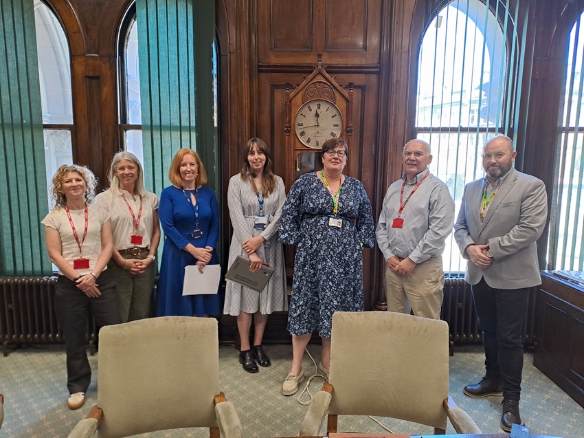 A group photo taken inside City Hall, Bradford.